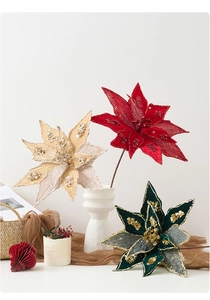 Detail of velvet Christmas flowers with sparkling sequins for festive tree decoration