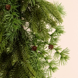 Realistic Norfolk pine garland with soft needles and pinecones for Christmas decor