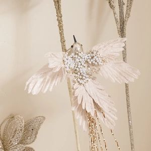 Elegant champagne feather bird ornament with pearls and gold glitter for Christmas decor