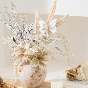 Elegant champagne Christmas floral arrangement with artificial flowers and butterfly in a vase