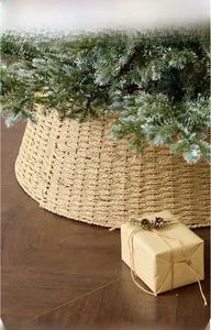 Detail of woven Christmas tree skirt basket showing natural straw texture on wood floor