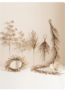 Close-up of champagne glitter Christmas decor with rose gold berries and decorative flowers