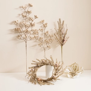 Champagne gold Christmas decorative branches with berries, pine needles and flowers