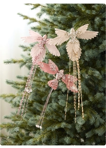 Detail of handmade Christmas hummingbird ornaments with sequins and beaded floral embroidery
