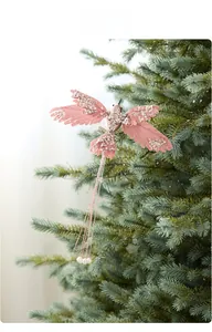 Pink fabric hummingbird Christmas ornament with silver sequins and white pearls on tree