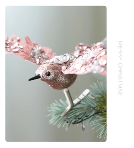 Detail of pink fabric hummingbird Christmas ornament with silver sequins and pearls
