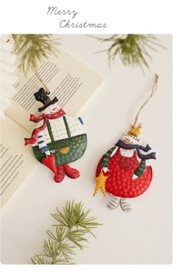 Retro hand-painted metal snowman ornaments with rustic twine hangers for Christmas decor