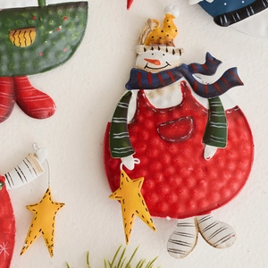 Hand-painted vintage metal snowman ornament with star and twine hanger for Christmas tree