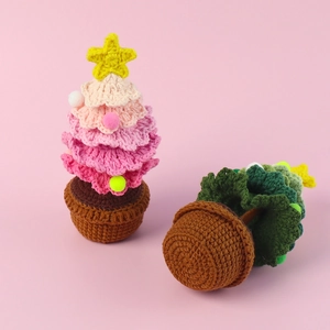 Detail of handmade crochet Christmas tree ornaments showing brown woven base and yarn texture
