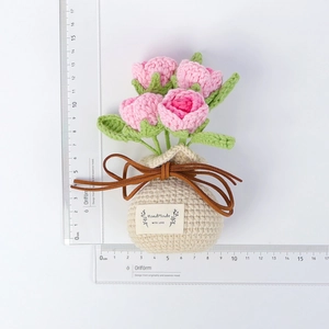 Detailed view of handmade crochet pink rose bouquet in beige pot with 13cm height scale