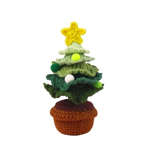 Handmade crochet Christmas tree in brown pot with yellow star and colorful pom-poms
