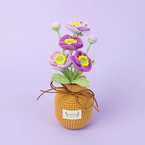 Handmade crochet gradient poppies in a woven vase with a handmade with love label