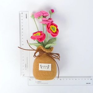 Handmade crochet gradient poppy flower in a knitted pot with 'HandMade WITH LOVE' label, 18cm height