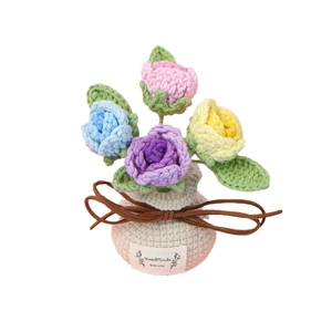Handmade crochet rose flower potted plant in a beige knit vase with leather bow decoration