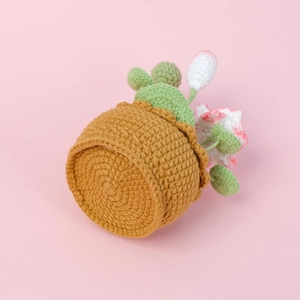 Detailed close-up of handmade crochet lotus potted plant with intricate woven texture