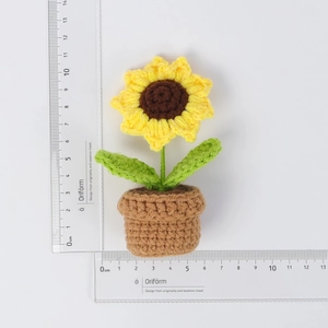 Detailed size reference of handmade crochet sunflower pot with dimensions on white background