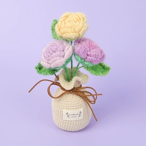 Handmade crochet mohair rose bouquet in beige woven pot with purple background