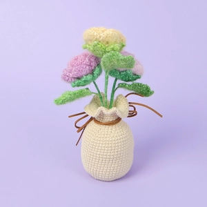 Detailed knit texture of handmade crochet roses in a woven vase for home decoration