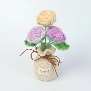 Detail of handmade crochet flowers in a white base with HandMade WITH LOVE label