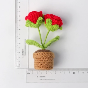 Handmade crochet red daisy potted plant showing size measurements of 12cm height