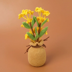 Handmade crochet honeysuckle potted flower in yellow with a woven lucky bag base