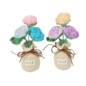 Handmade crochet rose potted plants in pink and purple colors for home decoration