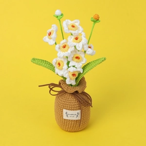 Detail of handmade crochet daffodil in brown pot with Handmade With Love label