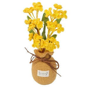 Handmade crochet honeysuckle potted plant with yellow flowers and a knitted vase