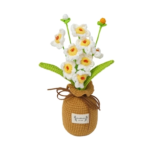 Handmade crochet narcissus potted plant with white petals and yellow centers in a pot