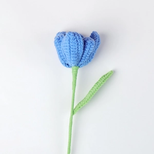 Detailed view of hand-knitted blue tulip flower with intricate crochet textures