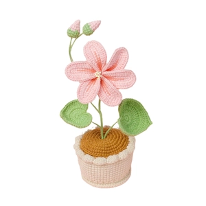 Fleur rose au crochet faite à la main en pot avec feuilles vertes pour décoration