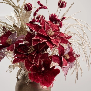 Elegant burgundy velvet poinsettia flowers with golden glitter branches for Christmas decor