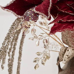 Velvet burgundy poinsettia with silver glitter edges and golden sequin leaves decoration