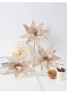 Close-up of champagne sequin Christmas flowers with mesh petals and beaded centers