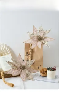 Champagne pink poinsettia decor with glitter sequins, wooden beads and jute tassel