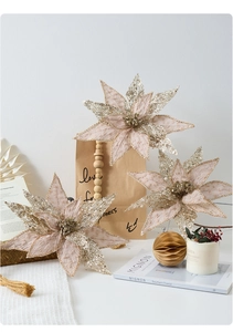 Detailed view of champagne glitter artificial poinsettia flowers for Christmas decoration