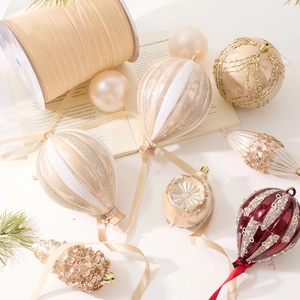 Christmas ornaments set featuring champagne hot air balloons and festive glitter baubles