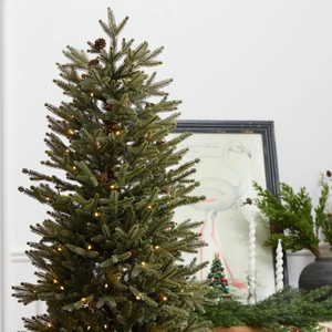 Artificial PE Christmas tree with warm LED lights and pine cones for home festive decor