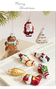 Detailed macro of colorful glass Christmas ornaments on vintage book pages and pine branches
