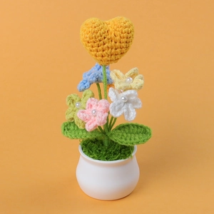 Handmade crochet heart and flower potted plant with pearls in white ceramic pot
