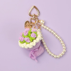 Handmade knitted flower bouquet keychain with purple roses and pearl strap decoration