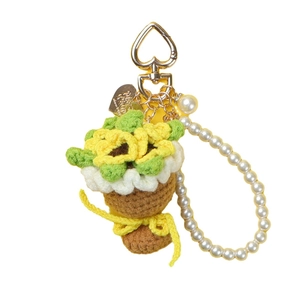 Handmade crochet sunflower keychain with green leaves and heart shaped metal clip