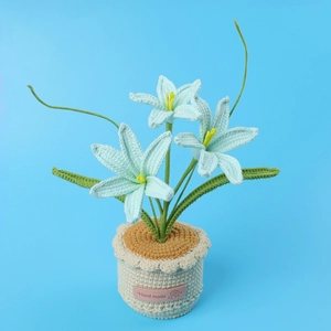 Handmade crochet light blue flower potted plant with green leaves and hand made label