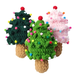 Handmade crochet Christmas tree ornaments in green and pink with colorful pom-poms