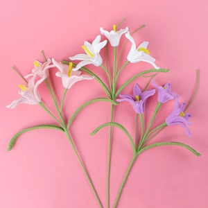 Handmade crochet lily flowers in white, pink, and purple for home decor display