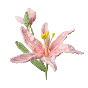 Handmade crochet pink lily flower bouquet with green leaves on white background