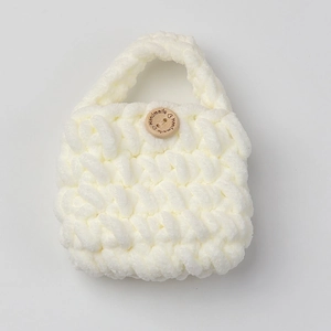 Close-up of handmade white chenille crochet earphone case with a wooden button detail