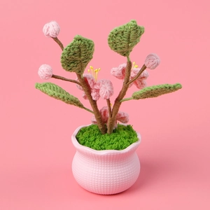Handmade crochet pink cherry blossom potted plant with ceramic base for desk decor