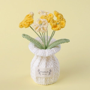 Detailed knit texture of handmade crochet sunflower pot with Handmade With Love label