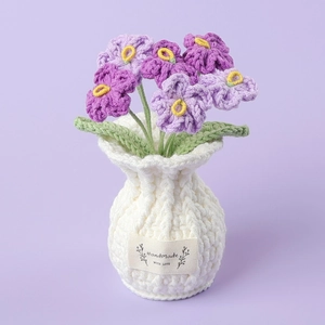 Handmade crochet forget-me-not potted plant in purple with white knitted vase